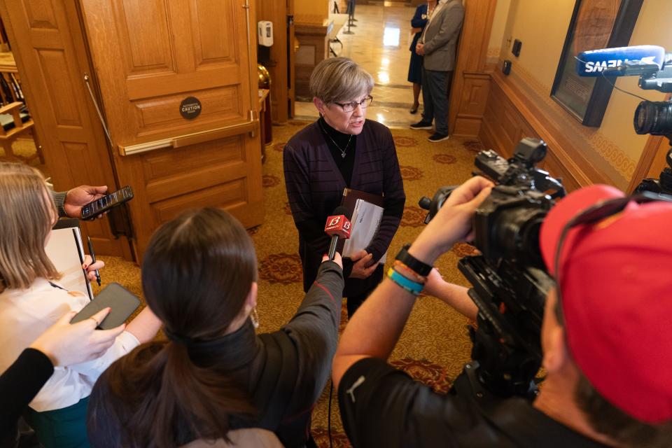 Gov. Laura Kelly answers questions by the media last month as lawmakers prepare to kick off the 2024 legislative session Monday.