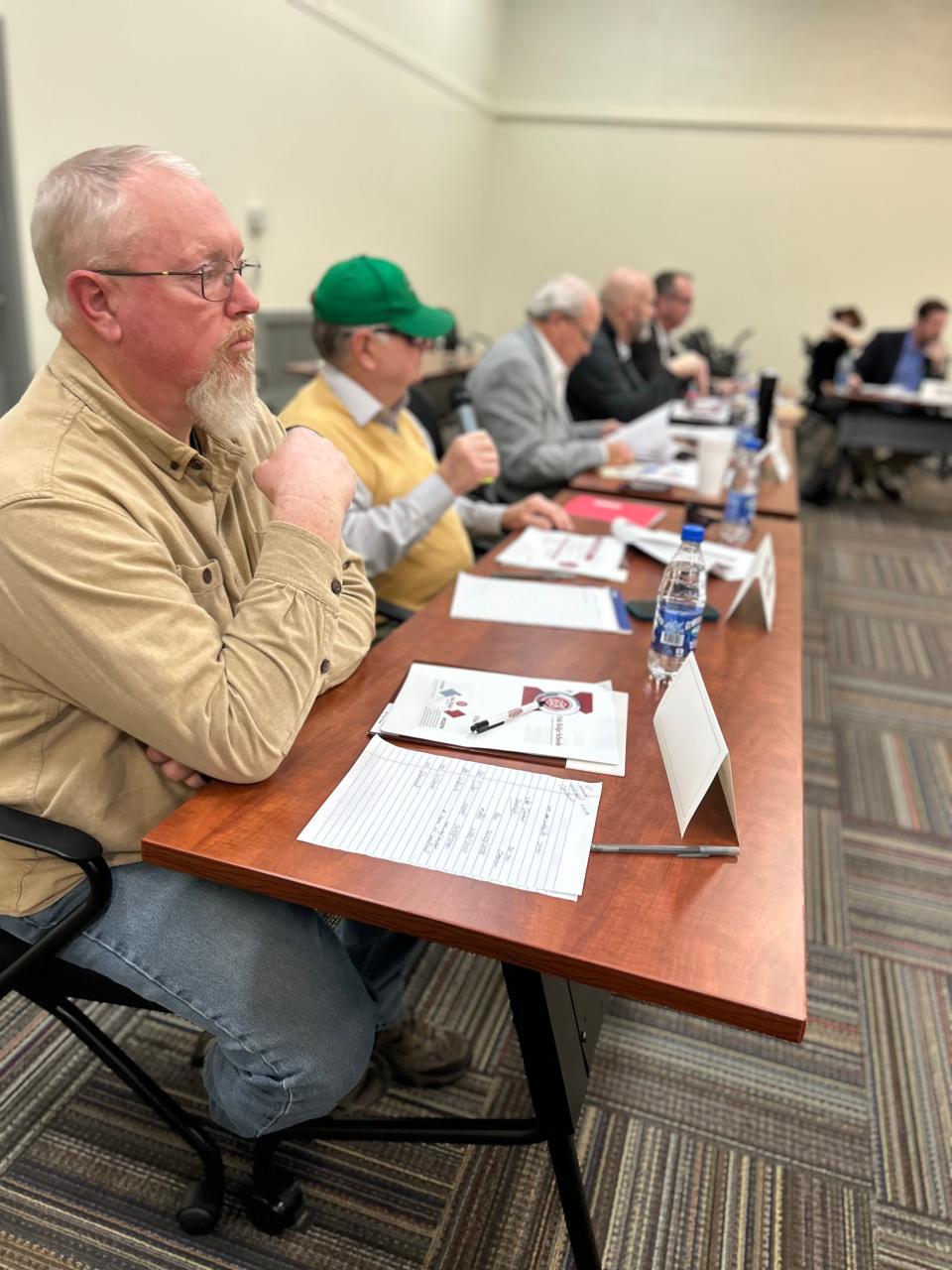 Oak Ridge City Council member Chuck Hope, forefront, listens to member Charlie Hensley's question on the Oak Ridge Schools' recommendation on how to handle with the rising student population. Going down the line from Hensley is Mayor Warren Gooch, Mayor Pro Tem Jim Dodson and member Sean Gleason. The joint meeting of Oak Ridge City Council and Board of Education was held Feb. 20, 2024 in the School Administration Building.