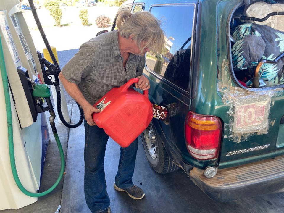 Gary St. Pierre puts gas in his car Wednesday, Oct. 4, 2023, at the AM/PM gas station at Churn Creek Road and Mistletoe Lane in Redding, California, where the price of gasoline averages more than $5 a gallon.