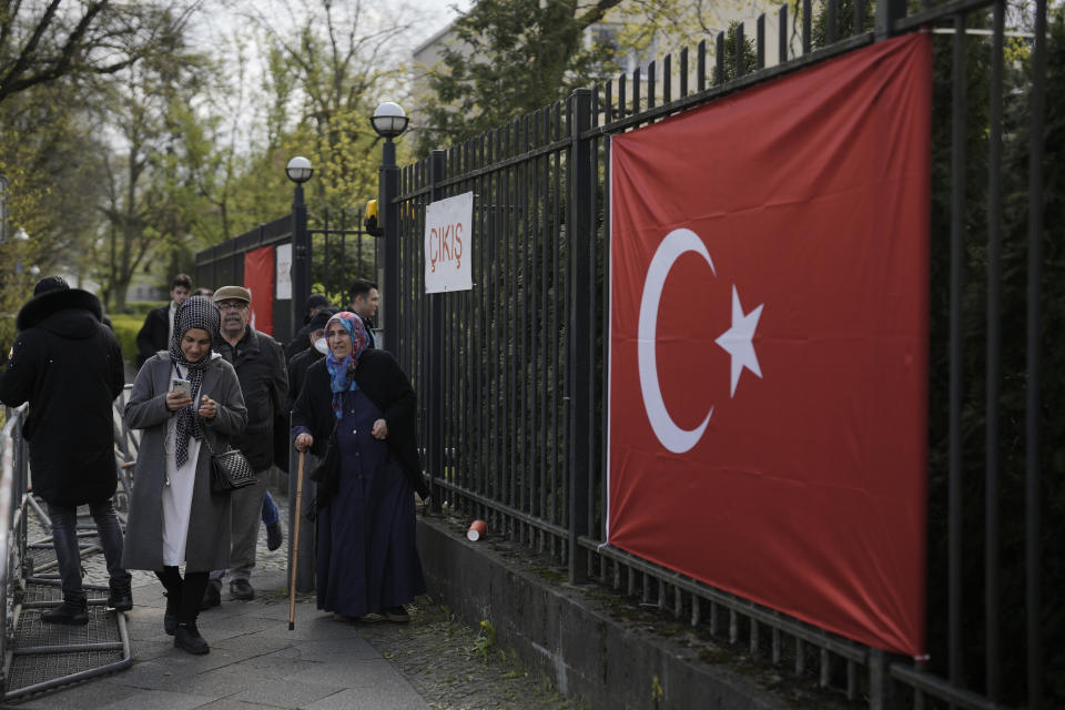 Turkish citizens living in Germany leave a polling station at the Turkish consulate after they cast their vote for Turkish the parliament and president election in Berlin, Germany, Thursday, April 27, 2023. Millions of Turkish citizens living abroad have began voting in national elections that will decide whether President Recep Tayyip Erdogan can govern Turkey for another term. Among the biggest contingent of overseas voters are 1.5 million Turks in Germany, who can cast their votes in presidential and parliamentary elections at 16 polling sites across the country until May 9. (AP Photo/Markus Schreiber)