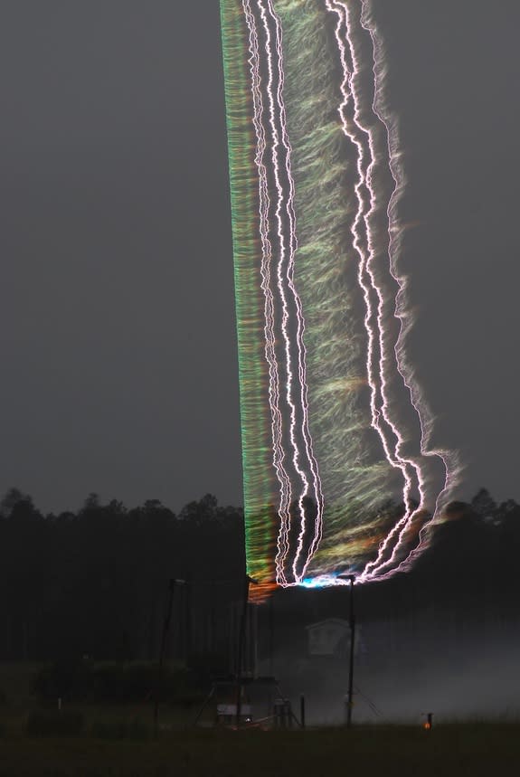 A triggered lightning experiment conducted in Florida as part of an ongoing research effort to better understand how lightning forms. The blue-green light in the image is from copper in the initial triggering wire being heated to the point of r