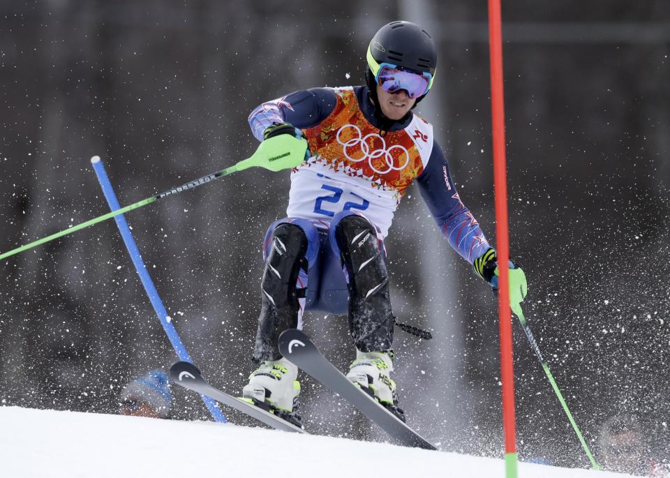 United States' Ted Ligety makes a turn during the slalom portion of the men's supercombined at the Sochi 2014 Winter Olympics, Friday, Feb. 14, 2014, in Krasnaya Polyana, Russia. (AP Photo/Luca Bruno)