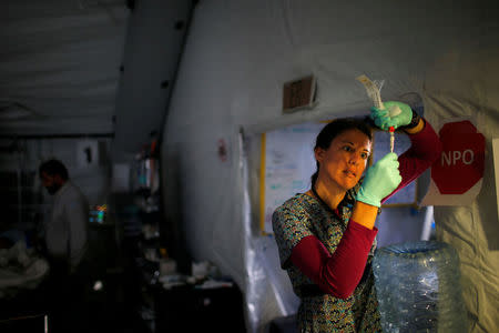 A foreign volunteer works at the emergency field hospital which is run by the US Christian charity Samaritan's Purse, eastern Mosul, Iraq March 22, 2017. REUTERS/Suhaib Salem