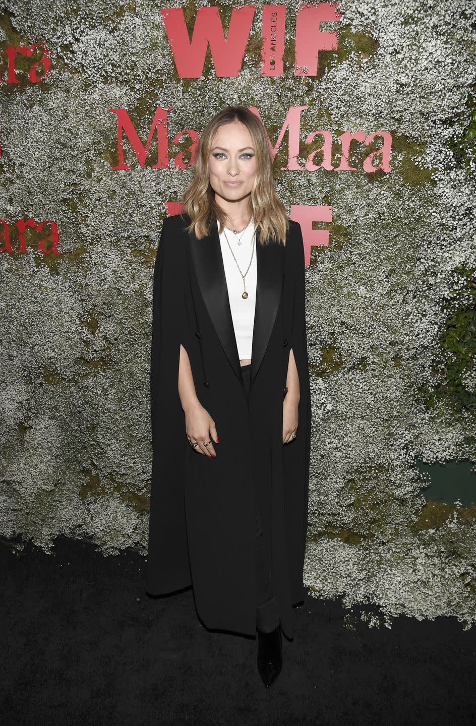 <p>The actress decked herself out in a black Max Mara cape jacket, a white T-shirt and black heeled boots at the Chateau Marmont-located event in Los Angeles. </p>