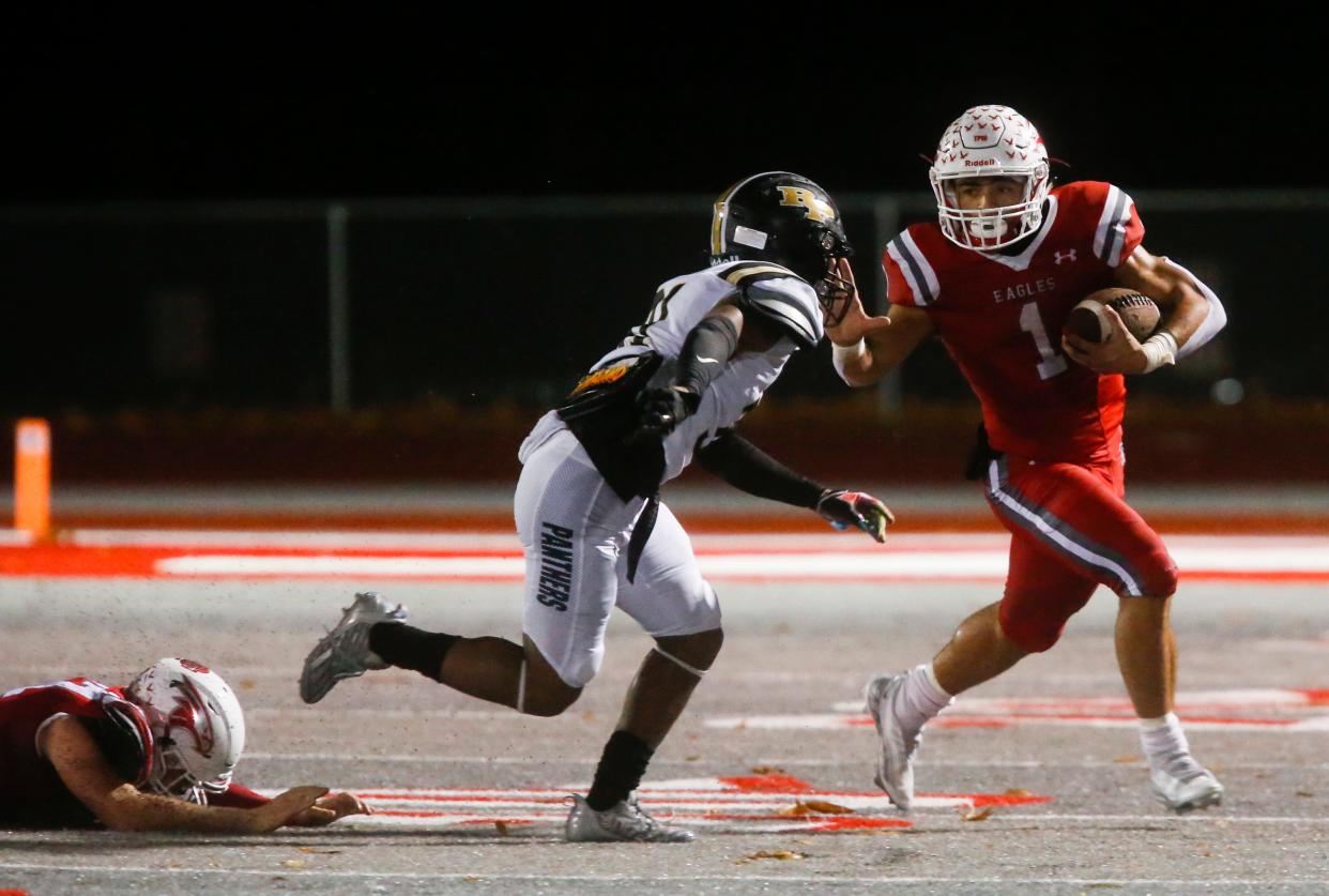 Nixa's Ramone Green carries the ball as the Eagles take on the Raymore-Peculiar Panthers during a rainy Class 6 District 3 semifinal game at Nixa on Friday, Nov. 4, 2022.