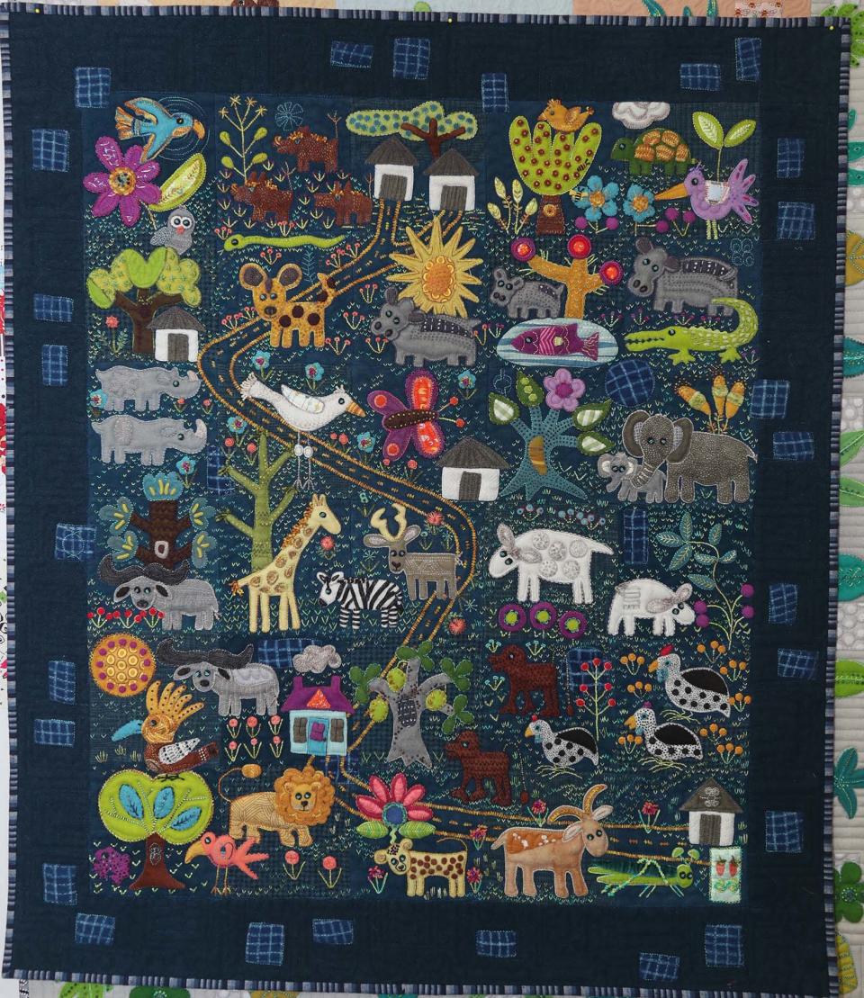 This quilt by Sue Spargo, titled “Folk-tails,” is inspired by Spargo's childhood in South Africa.