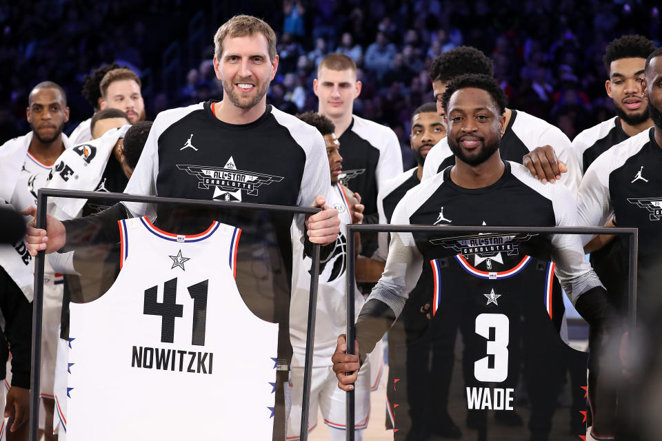 Dirk Nowitzki And Dwyane Wade Holding NBA All-Star Jerseys 