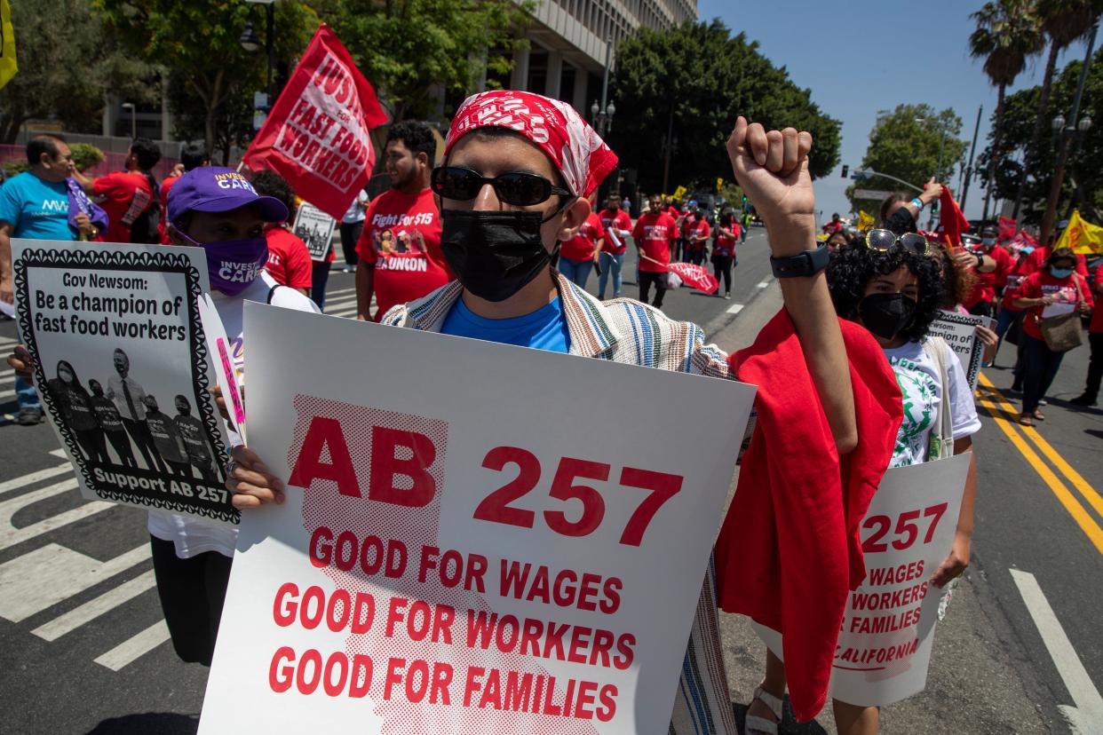 Fast-food workers lead a march to the state building on Spring Street after rally at Los Angeles City Hall to protest unsafe working conditions, and to demand a voice on the job through AB 257 Thursday June 8 2022 in Los Angeles.