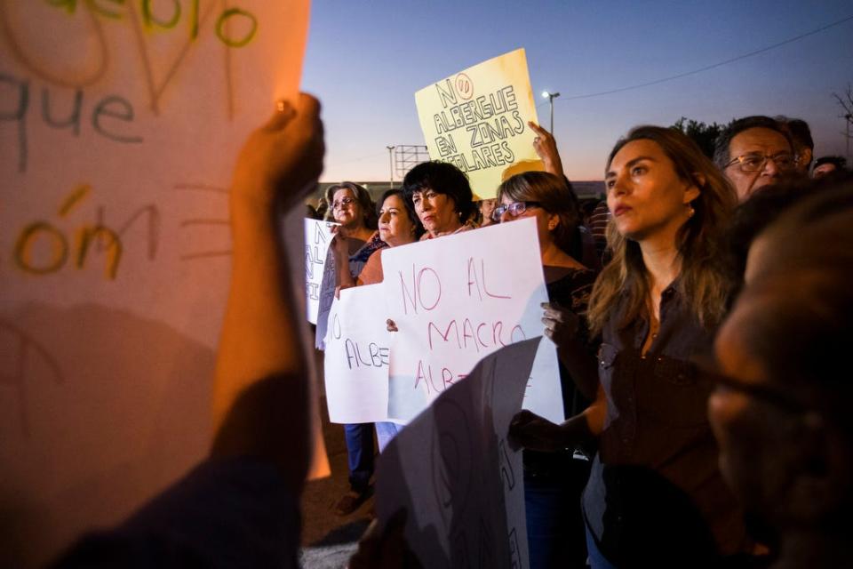 Residents of Mexicali, Mexico, gather Monday, Oct. 14, 2019, to protest the possible opening of a migrant shelter for Migrant Protection Protocol migrants from Central America who are waiting for a court hearing in the U.S. in order to seek asylum.