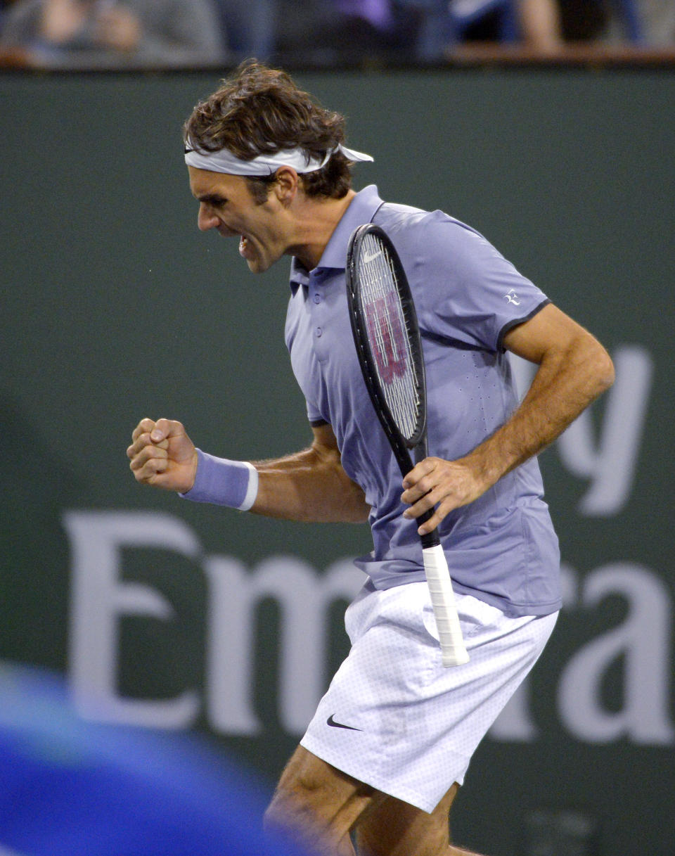 Roger Federer, of Switzerland, reacts after winning the first set over Kevin Anderson, of South Africa, in the quarterfinals of the BNP Paribas Open tennis tournament, Thursday, March 13, 2014, in Indian Wells, Calif. (AP Photo/Mark J. Terrill)