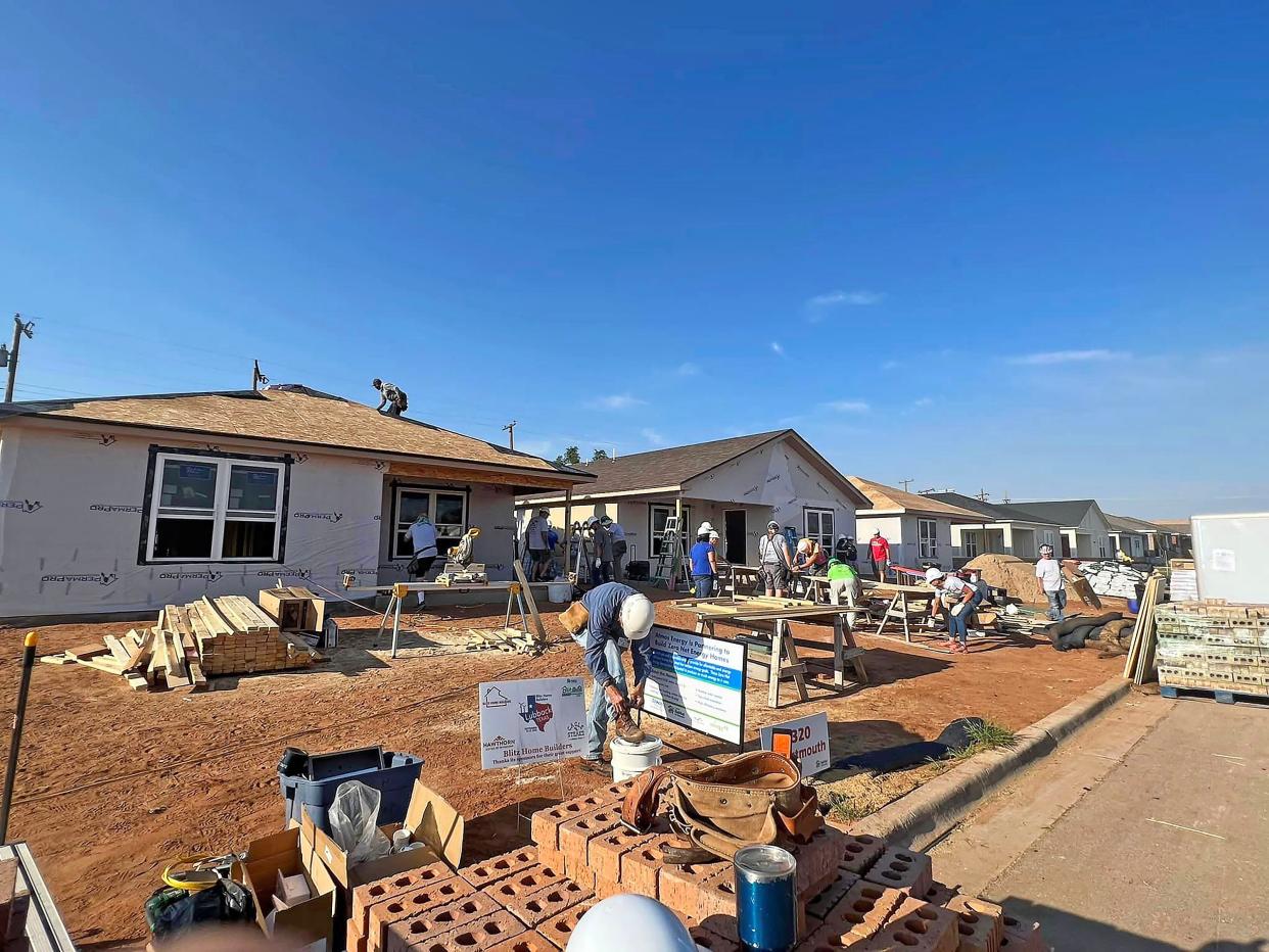 Exterior work is conducted on a group of Habitat for Humanity blitz build homes in Lubbock Texas in September 2022. Columbia was selected as the 2023 blitz build site at Show Me Central Habitat's Boone Prairie subdivision. 