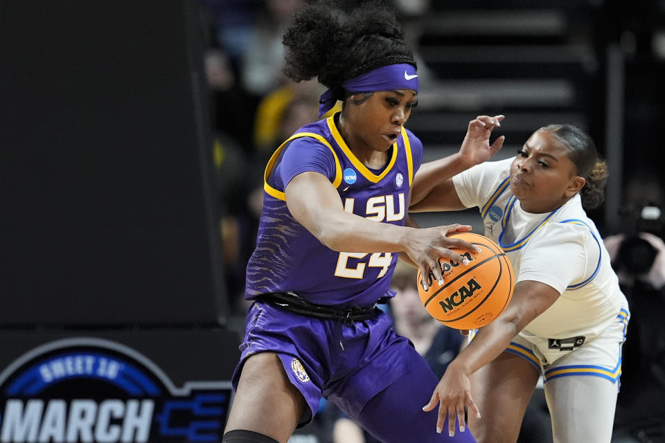 UCLA guard Londynn Jones, right, tries to strip the ball from LSU guard Aneesah Morrow (24) during the third quarter of a Sweet Sixteen round college basketball game during the NCAA Tournament, Saturday, March 30, 2024, in Albany, N.Y. (AP Photo/Mary Altaffer)