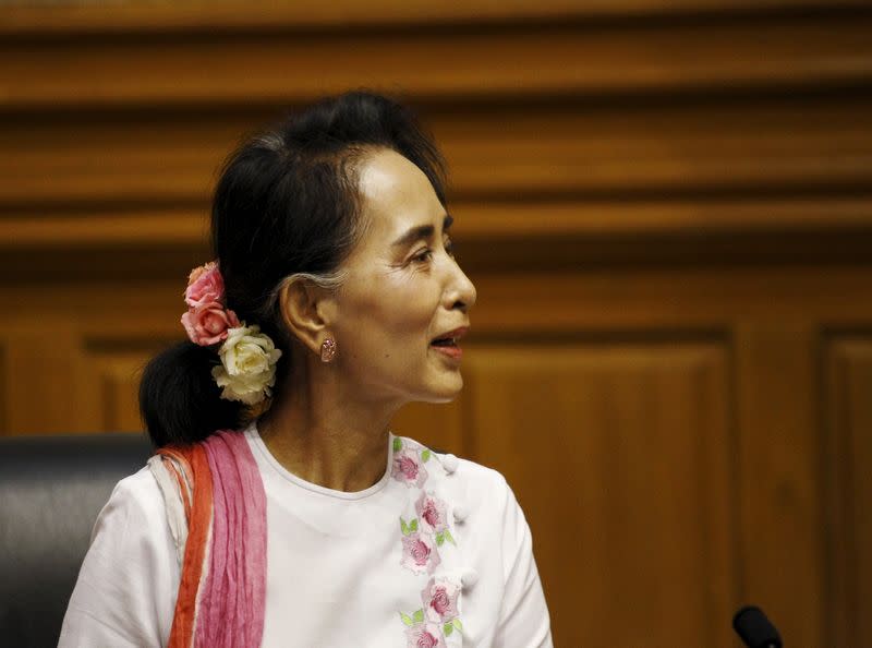 NLD leader Aung San Suu Kyi talks to Shwe Mann, speaker of Myanmar's Union Parliament, during their meeting at the Lower House of Parliament in Naypyitaw