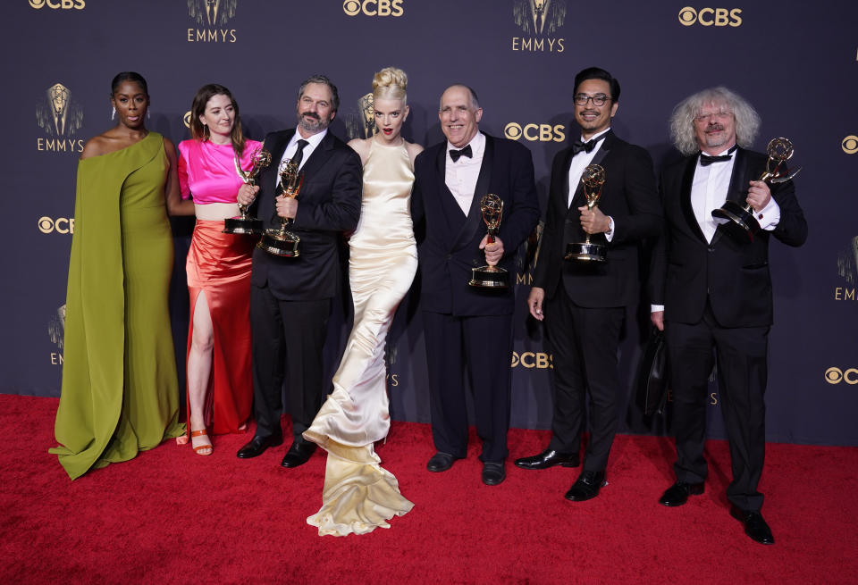 Moses Ingram, from left, Marielle Heller, Scott Frank, Anya Taylor-Joy, William Horberg, Mick Aniceto and Marcus Loges, winners of the award for outstanding directing for a limited or anthology series or movie for "The Queen's Gambit", pose at the 73rd Primetime Emmy Awards on Sunday, Sept. 19, 2021, at L.A. Live in Los Angeles. (AP Photo/Chris Pizzello)