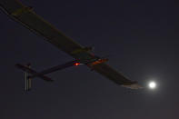 The Solar Impulse HB-SIA experimental aircraft flies after taking off from Barajas airport in Madrid, Spain, in the early hours of Tuesday, June 5, 2012. The zero fuel airplane arrived in Madrid on May 25, 2012 from Payerne, Switzerland, and now goes on to Rabat, Morocco on its first transcontinental trip. The mission is described as the final dress rehearsal for a round-the-world flight with a new and improved aircraft in 2014. (AP Photo/Alberto Di Lolli)