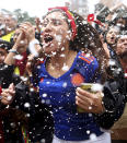 <p>Colombian fans watching the match in Bogota celebrate after their side topped Group H </p>