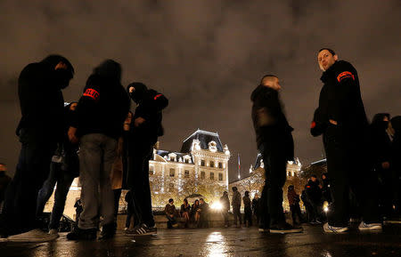 Police officers gather during an unauthorised protest against anti-police violence in front of the Police Prefecture in Paris, France, October 21, 2016. REUTERS/Jacky Naegelen