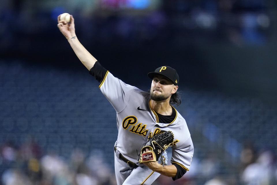 Pittsburgh Pirates starting pitcher JT Brubaker throws a pitch against the Arizona Diamondbacks during the first inning of a baseball game Thursday, Aug. 11, 2022, in Phoenix. (AP Photo/Ross D. Franklin)