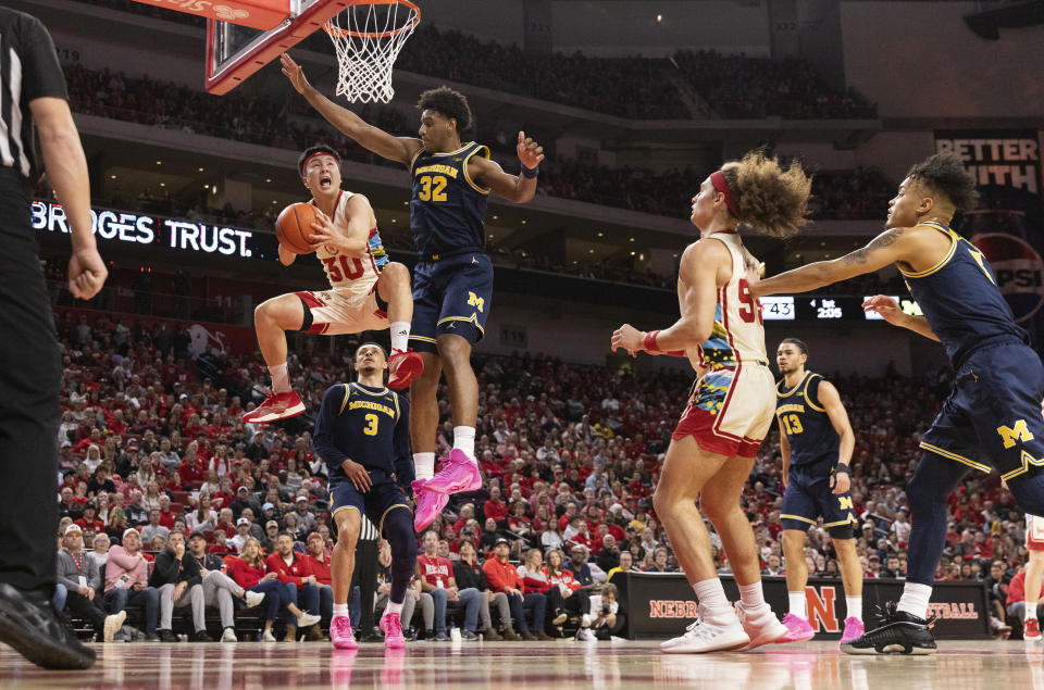 Nebraska's Keisei Tominaga (30) shoots against Michigan's Tarris Reed Jr. (32) during the first half of an NCAA college basketball game, Saturday, Feb. 10, 2024, in Lincoln, Neb. (AP Photo/Rebecca S. Gratz)