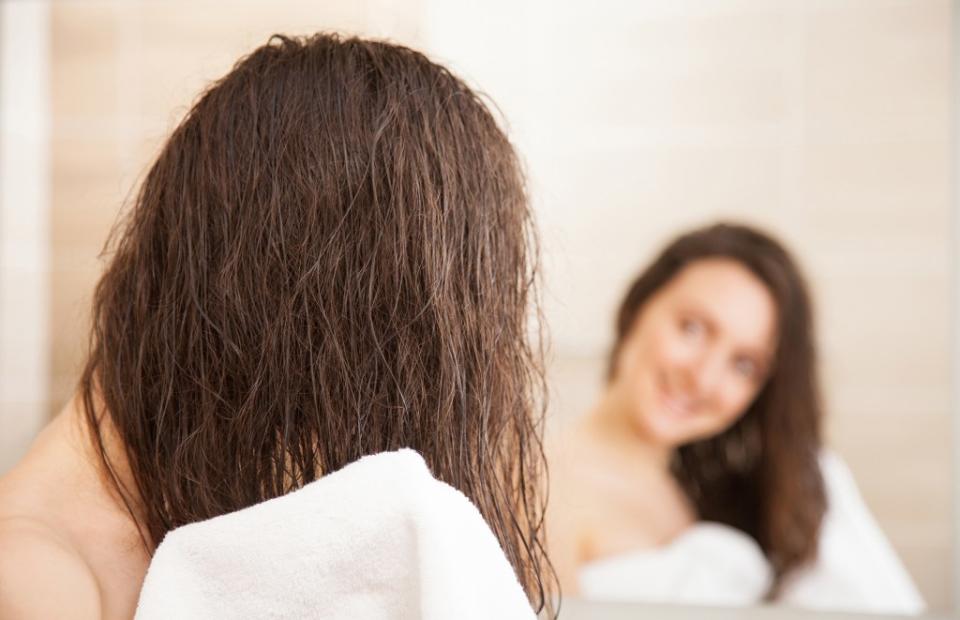 Shirazi says she never dries her hair by rubbing it with a towel. zest_marina – stock.adobe.com