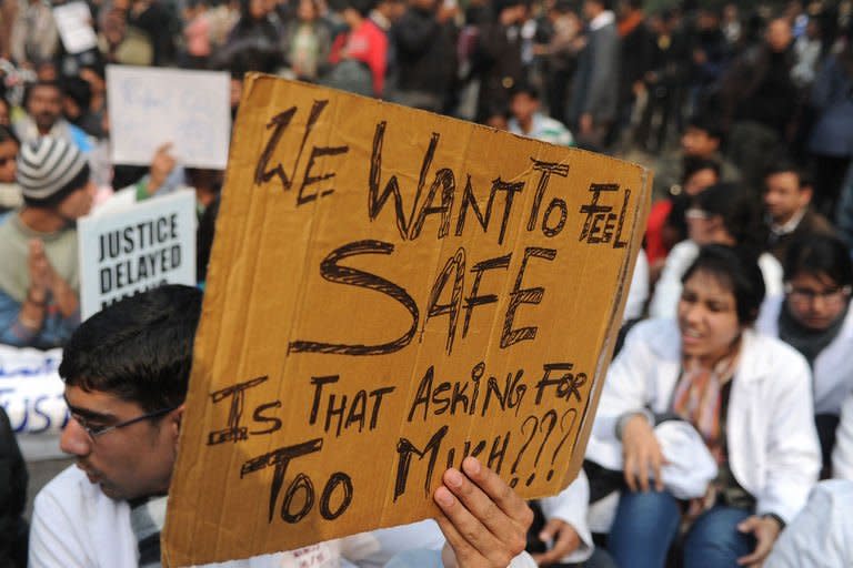 An Indian demonstrator holds a placard during a protest calling for better safety for women following the rape of a student in New Delhi on December 24, 2012. Indian Prime Minister Manmohan Singh has appealed for calm and vowed to protect women as police struggled to quell increasing outrage over sex crimes following the gang-rape of a student