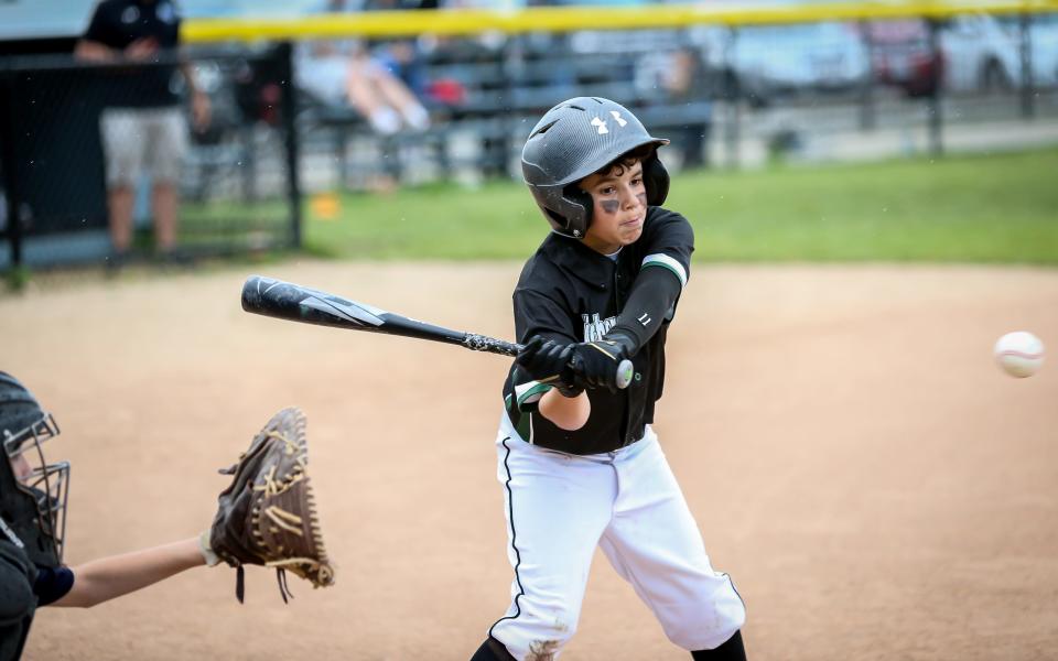 Jameson Silva of Kitchens & Baths is locked in on the ball during a recent game at Whaling City Youth Baseball League.