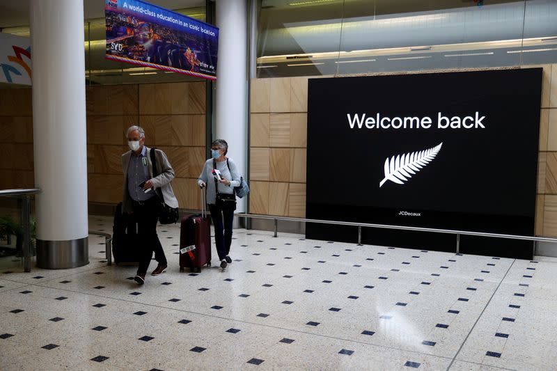 FILE PHOTO: Passengers arrive from New Zealand after the Trans-Tasman travel bubble opened overnight, at Sydney Airport