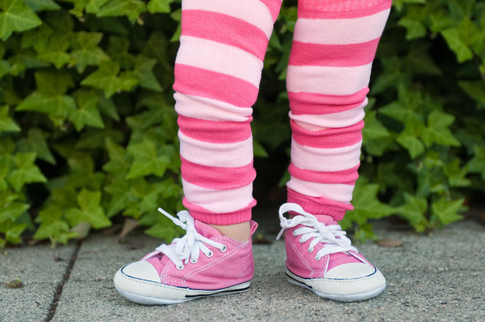 a toddler in pink clothes