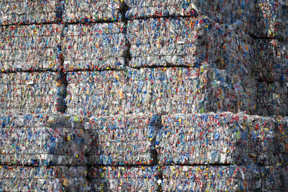 Sorting facilities like TotalRecycle crush plastics together into bales so they can be transported. (Photo: Bloomberg Creative Photos via Getty Images)