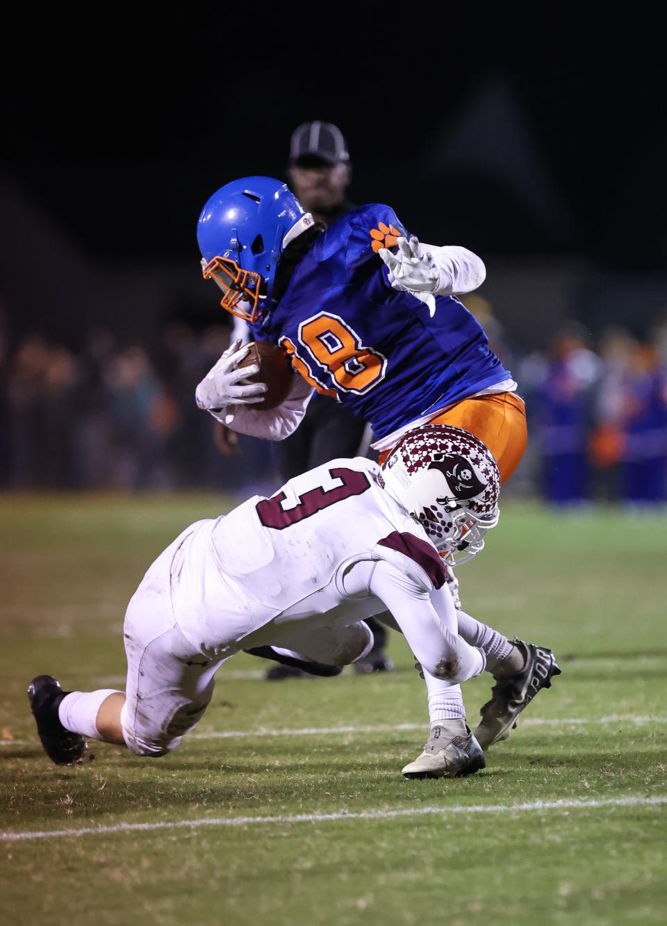 Caravel junior Bryce McKinnon brings down Delmar sophomore Isaiah Holbrook after a short run during Caravel’s 24-14 win over the Wildcats at Francis E. Nunvar Stadium on Friday.