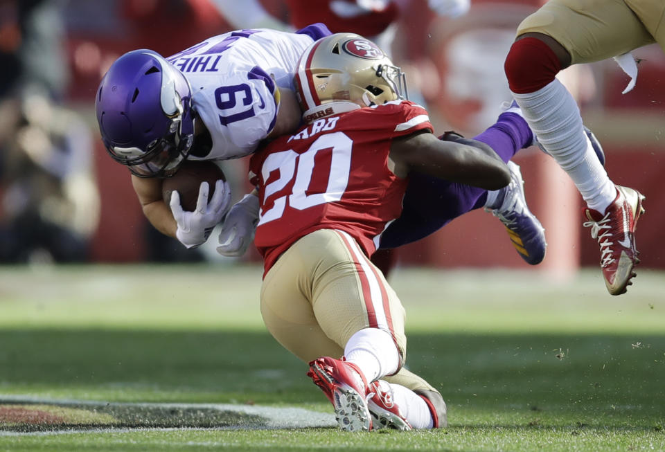 Minnesota Vikings wide receiver Adam Thielen (19) is tackled by San Francisco 49ers free safety Jimmie Ward (20) during the first half of an NFL divisional playoff football game, Saturday, Jan. 11, 2020, in Santa Clara, Calif. (AP Photo/Ben Margot)