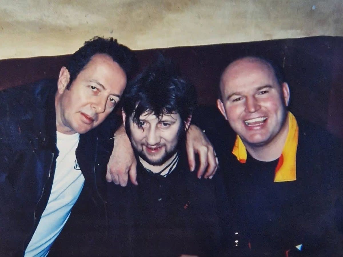 MacGowan with his former pub landlord Phillip Ryan and the late Joe Strummer (Supplied)