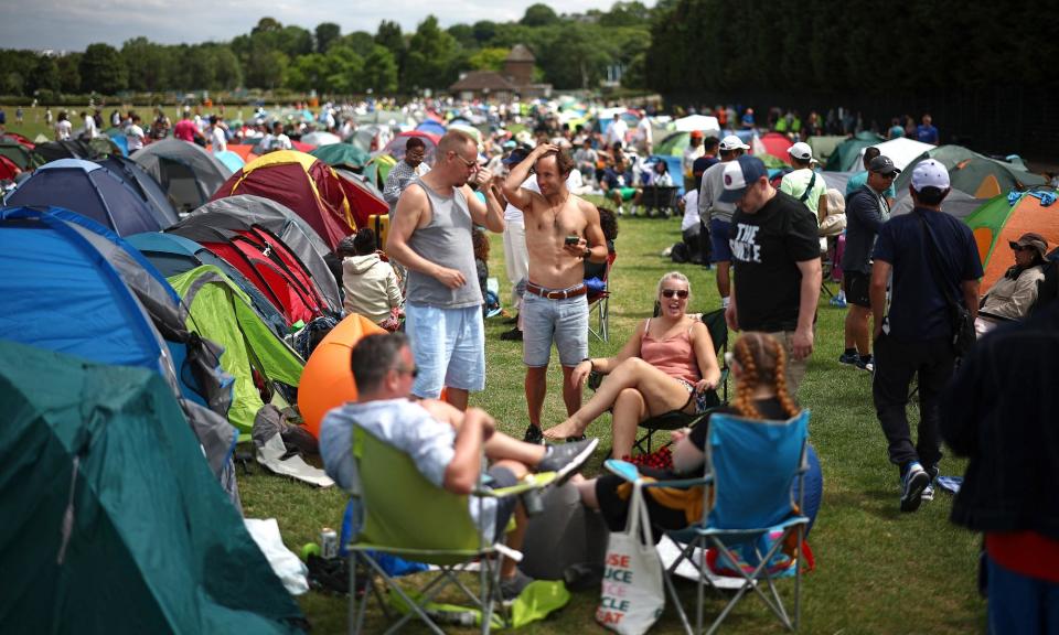 <span>Tennis fans have been camping in Wimbledon Park to get a good spot in the queue for tickets.</span><span>Photograph: Henry Nicholls/AFP/Getty Images</span>