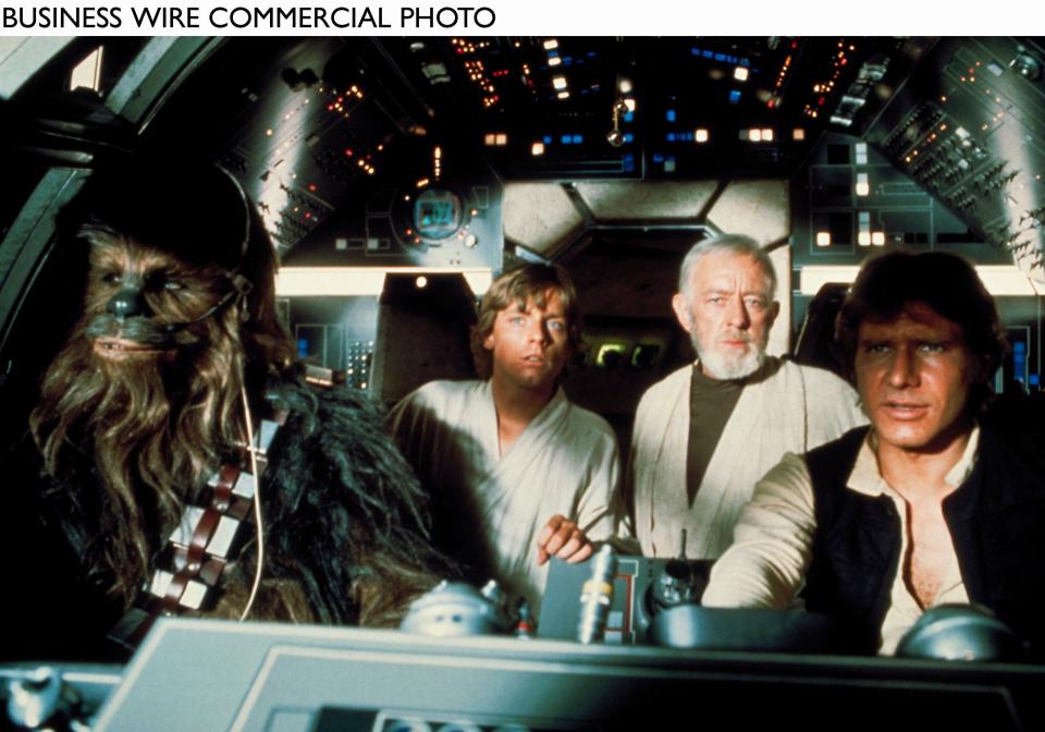 Peter Mayhew, left, Mark Hamill, Sir Alec Guinness and Harrison Ford appear in a scene from 1977's "Star Wars: Episode IV — A New Hope." (c) Lucasfilm Ltd. & TM. All rights reserved. Used with permission.