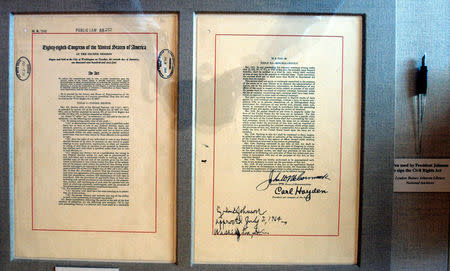 FILE PHOTO: The actual Title VII of the Civil Rights Act of 1964 document and pen is on display in the East Room of the White House in Washington, DC, U.S. on July 1, 2004. REUTERS/Mannie Garcia/File Photo