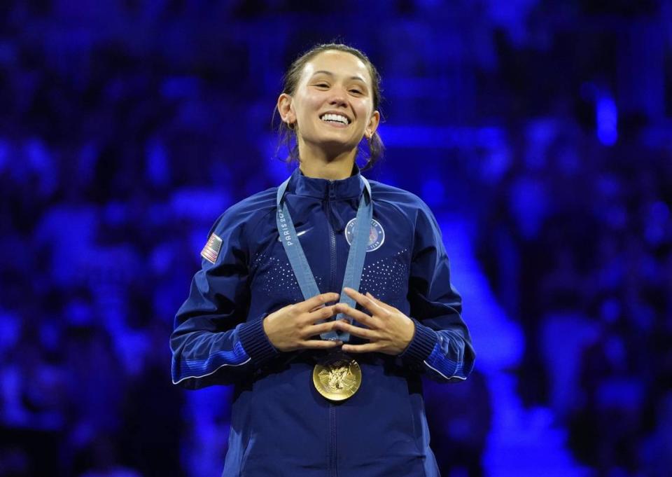 Jul 28, 2024; Paris, France;  Gold medalist Lee Kiefer (USA) on the podium after the women’s foil fencing competition during the Paris 2024 Olympic Summer Games at Grand Palais. Mandatory Credit: Andrew P. Scott-USA TODAY Sports