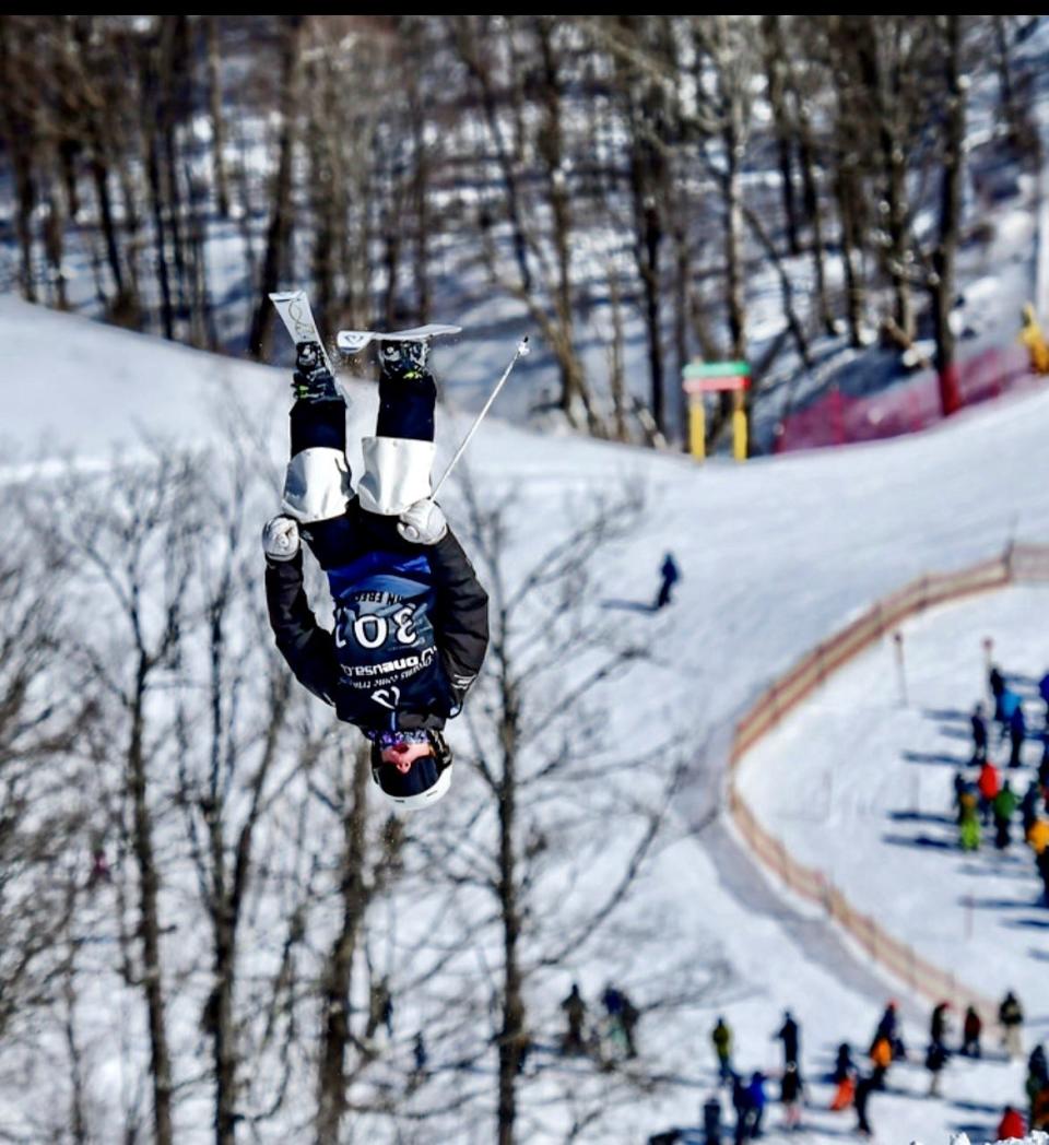 Eden Kruger performs an aerial stunt during her mogul ski run at the U.S. Freestyle Junior Nationals in Steamboat, Colorado.