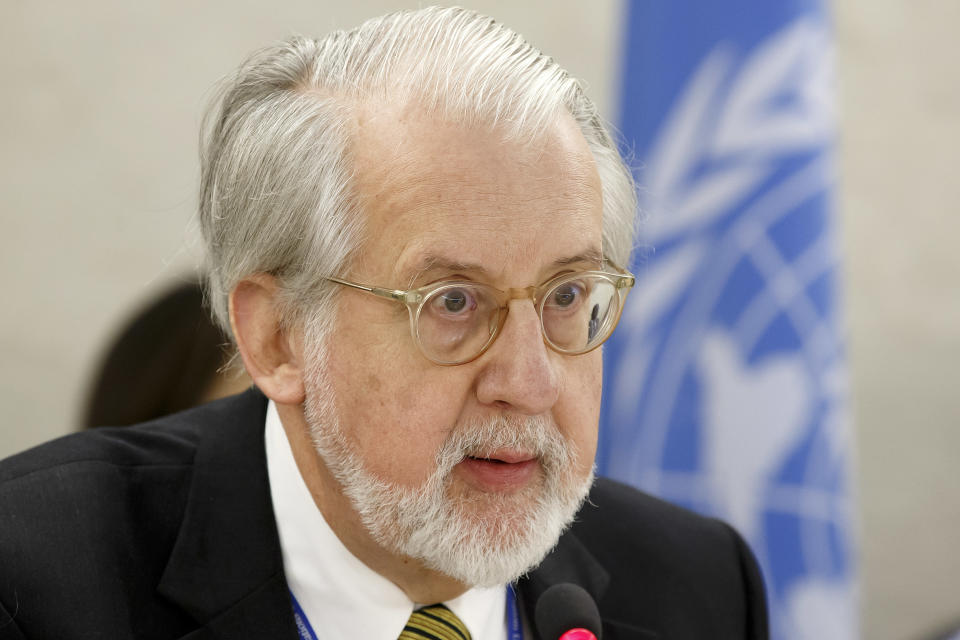 Brazilian Paulo Pinheiro, Chairperson of the Commission of Inquiry on Syria, presents his report during a session of the Human Rights Council on the report of the Commission of Inquiry on Human Rights in Syria at the European headquarters of the United Nations in Geneva, Switzerland, Tuesday, March 18, 2014. (AP Photo/Keystone, Salvatore Di Nolfi)