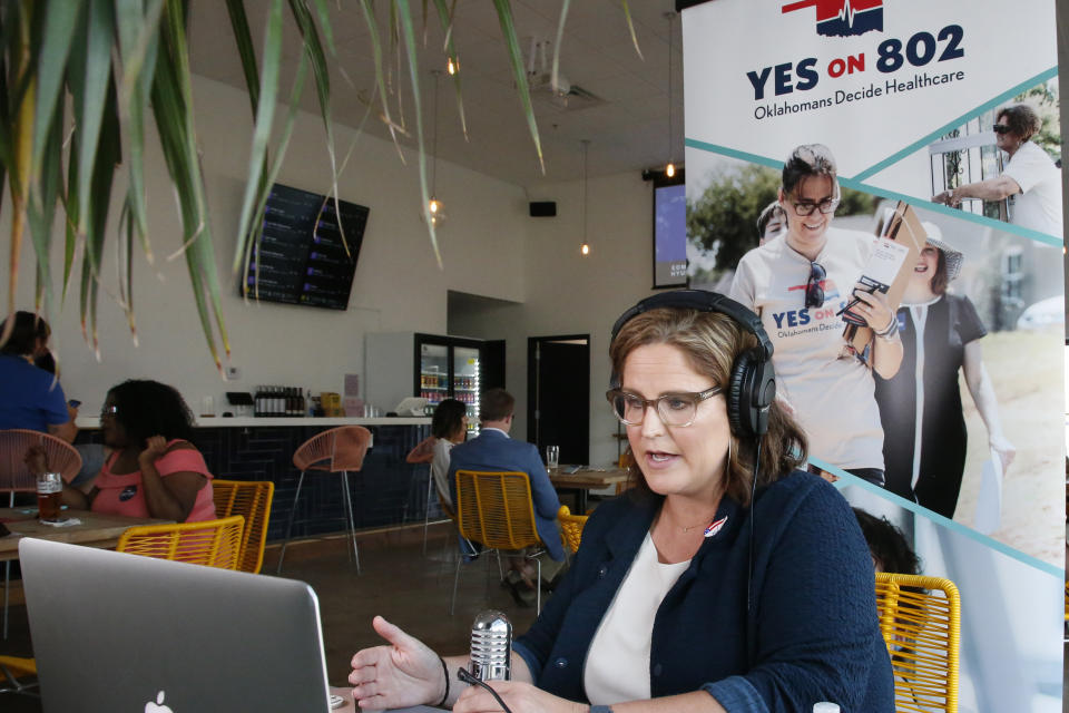 Amber England, campaign manager for Yes on 802, addresses supporters via the internet Tuesday, June 30, 2020, in Oklahoma City. Supporter awaited results in a virtual watch party as Oklahoma voters decided whether to amend the state Constitution to expand Medicaid health coverage to tens of thousands of low-income residents. (AP Photo/Sue Ogrocki)