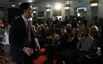 Britain's opposition Labour Party Leader Ed Milliband leaves the podium after speaking at the London Business School in London March 12, 2014. REUTERS/Suzanne Plunkett