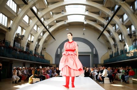 A model presents a creation during the Molly Goddard catwalk show during London Fashion Week in London