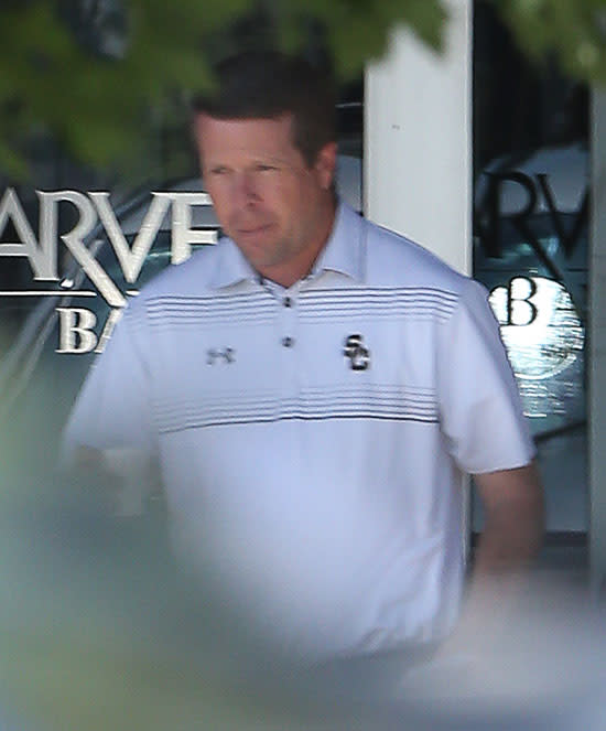 Reality star Jim Bob Duggar, patriarch of the Duggar family, was spotted in public on Tuesday for the first time since his eldest son Josh was embroiled in an Ashley Madison scandal less than a week ago. Jim Bob, 50, who gained fame appearing with his sizable family on TLC's <em>19 Kids and Counting</em>, was photographed running errands around his home town of Springdale, Arkansas. TheImageDirect.com <strong>WATCH: Josh and Anna Duggar Hide Out in Mountain Home as Family Avoids Public Eye </strong> It appears Jim Bob left the family's large compound to make a stop at their local bank. An eyewitness tells ET that Jim Bob drove fast and was openly irritated at the photographer who snapped his picture. After leaving, Jim Bob immediately returned to the family home. Jim Bob, his wife Michelle, and most of their family have been keeping a low profile after Josh publically admitted to being unfaithful to his wife Anna in a statement released last Thursday. Josh's admission came after hackers leaked a list of people who have private accounts with Ashely Madison -- an adult dating site aimed at helping people in relationships connect to have affairs. <strong>WATCH: Josh Duggar Addresses Ashley Madison Accounts: I'm Addicted to Porn, Have Been Unfaithful to My Wife </strong> "I have been the biggest hypocrite ever," wrote Josh. "While espousing faith and family values, I have been unfaithful to my wife." The original statement included an admission to "viewing pornography on the internet," which was later removed in a revised statement. After the admission, Josh and his wife went to stay at their farm house in the mountains of Arkansas, while Jim Bob and Michelle remained behind closed doors -- even skipping Sunday service at their church. <strong>WATCH: Josh Duggar Checks Into Treatment Center After Ashley Madison Scandal </strong> Earlier this year, Josh and the Duggar family found themselves in the media spotlight when Josh admitted to molesting five young girls -- four of whom were his younger sisters -- as a teenager. In the wake of the controversy, TLC cancelled 19 Kids and Counting in July, and Josh resigned from his job as a lobbyist for the Family Research Council. The same day that Jim Bob was photographed leaving his bank, the family released a statement claiming Josh has checked himself into a "long-term treatment center" and is seeking help. Check out the video below for more.