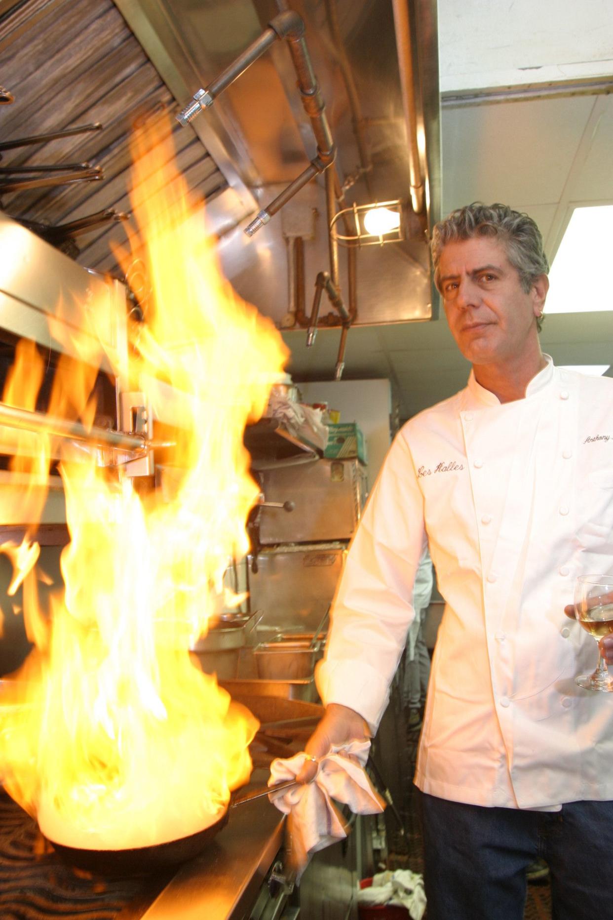 Author and chef of Les Halles Anthony Bourdain shows off his culinary skills in the Les Halles kitchen on Park Avenue in 2004.