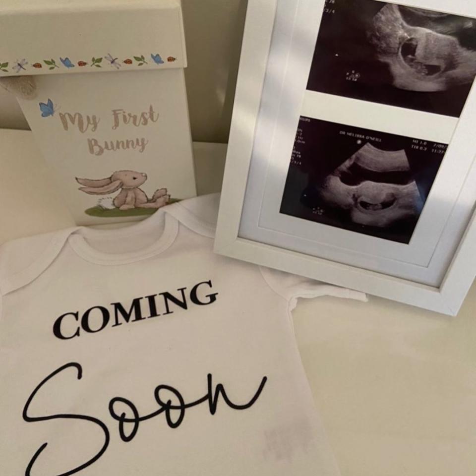 Tracey shared a sweet snap of the sonogram and a tiny onesie with the words 'coming soon' written across it. Photo: Instagram/Tracey Jewel