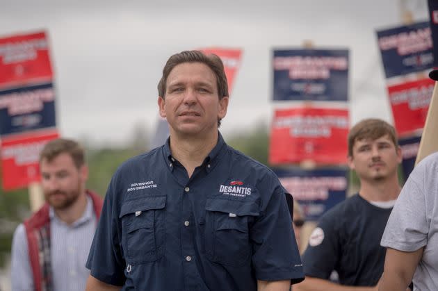 Florida Gov. Ron DeSantis (R) and his family took part in a Fourth of July parade in Wolfeboro, New Hampshire, as supporters held up campaign signs. 