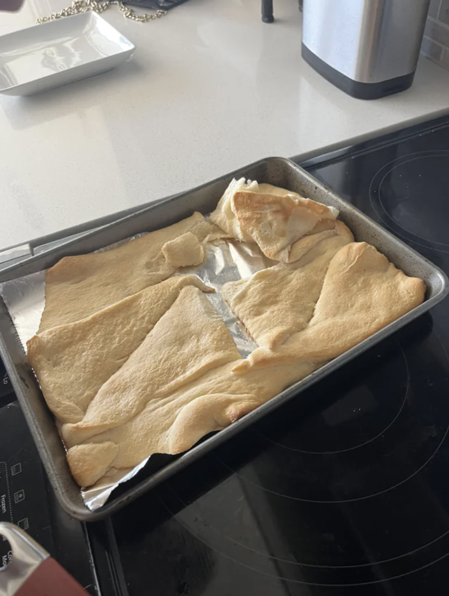 The uncooked dough is laid out flat instead of rolled into the shape of a croissant