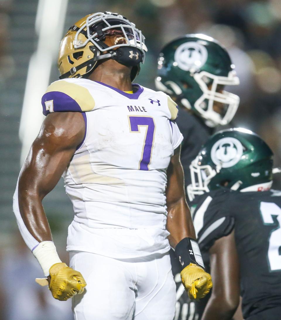 Male's Daniel Swinney celebrates a big gain in the second half against Trinity. The Bulldogs were able to score a field goal to beat the Shamrocks 23-21 in the waning seconds of the second half in Friday night football. Sept. 16, 2022