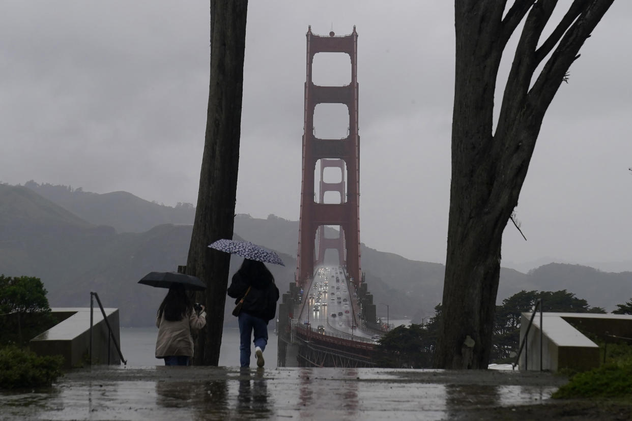 People walk down a path at the Golden Gate Overlook in San Francisco (Jeff Chiu / AP)