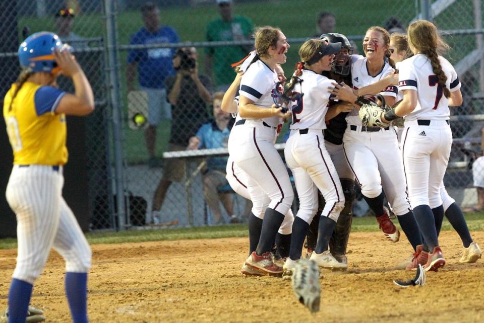 The BNL softball team celebrates following the final out of the victory over Castle to claim the crown at the Castle Regional Tuesday night.