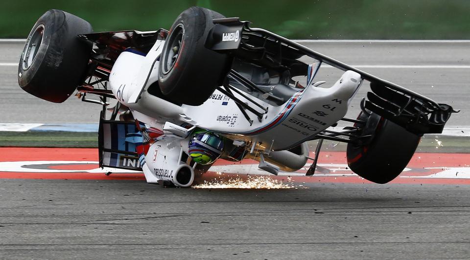 Williams Formula One driver Felipe Massa of Brazil crashes with his car in the first corner after the start of the German F1 Grand Prix at the Hockenheim racing circuit, in this July 20, 2014 file photo. REUTERS/Kai Pfaffenbach/Files (GERMANY - Tags: SPORT MOTORSPORT F1 TPX IMAGES OF THE DAY)